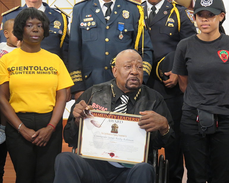 Commander James “Rocky” Robinson of the Bedford-Stuyvesant Volunteer Ambulance Corps is presented the Community Leadership Award by the Church of Scientology Harlem.