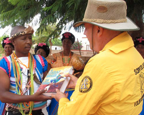 The Scientology Volunteer Ministers present a copy of the Scientology Handbook to the traditional healers of the Pedi Nation.