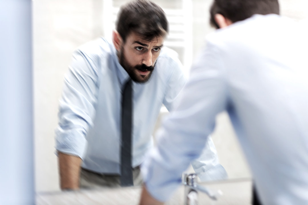 Man in a restroom having a flashback