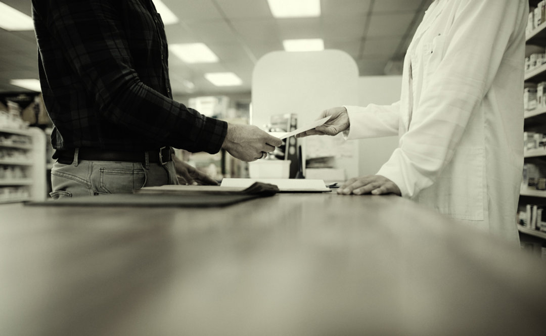 Pharmacy handing out prescription