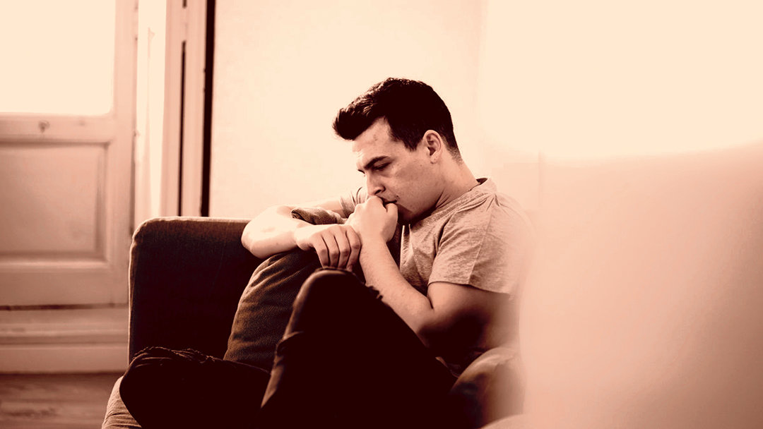 Person in a room showing signs of addiction