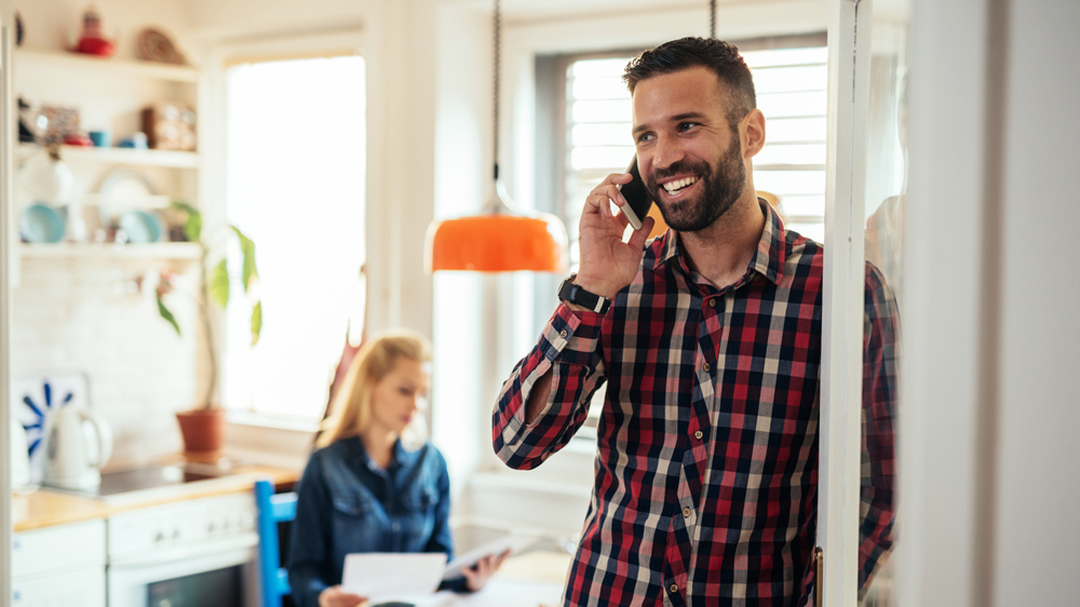 Happy Man Speaking on Phone