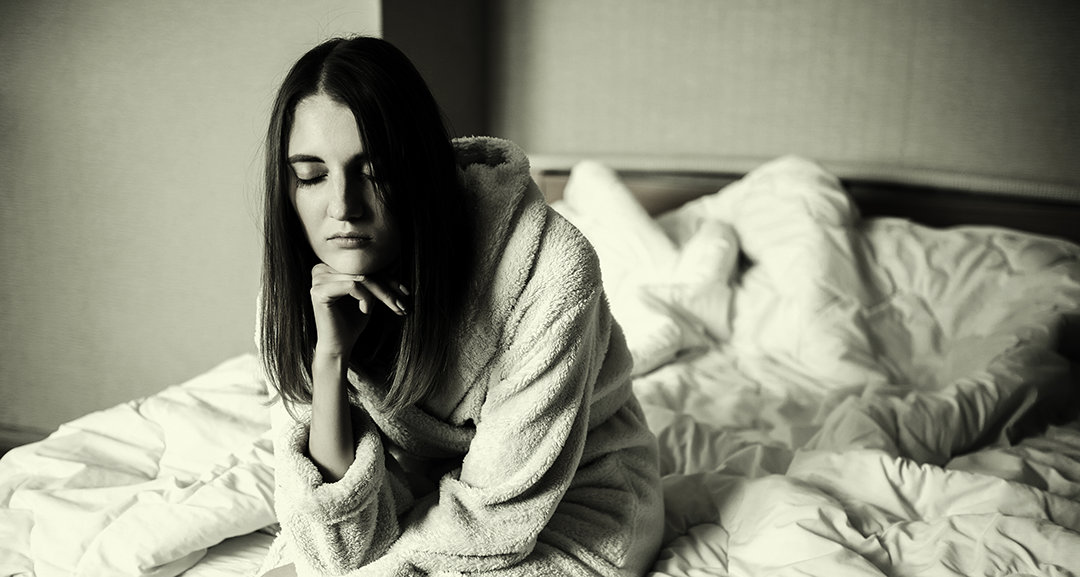 Young woman in a bedroom