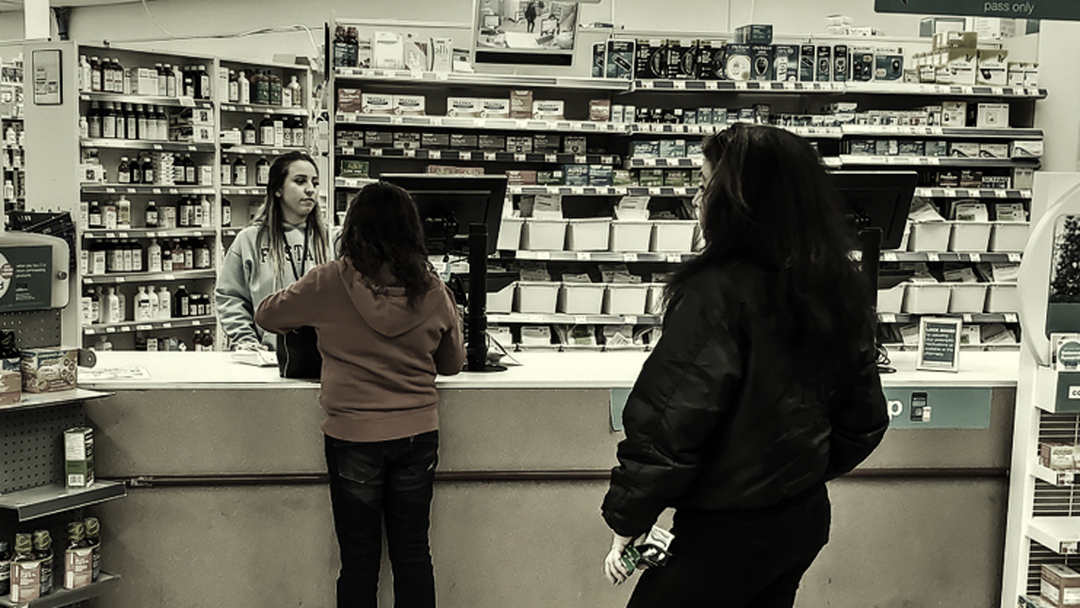 People shopping at a pharmacy