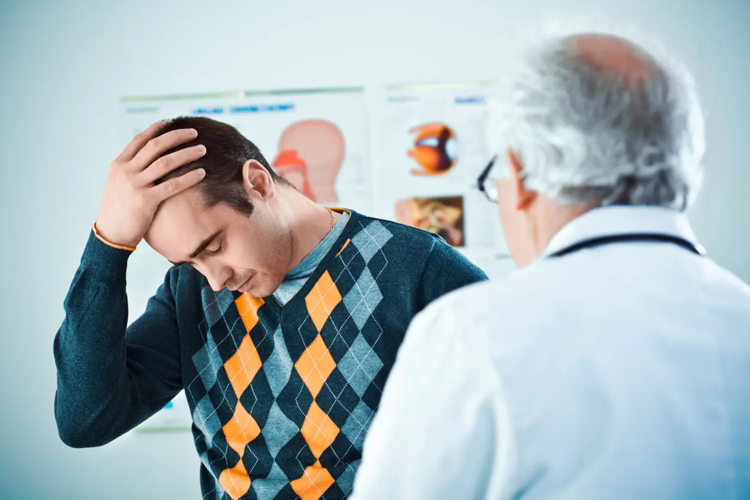 A man and a doctor in an interview room