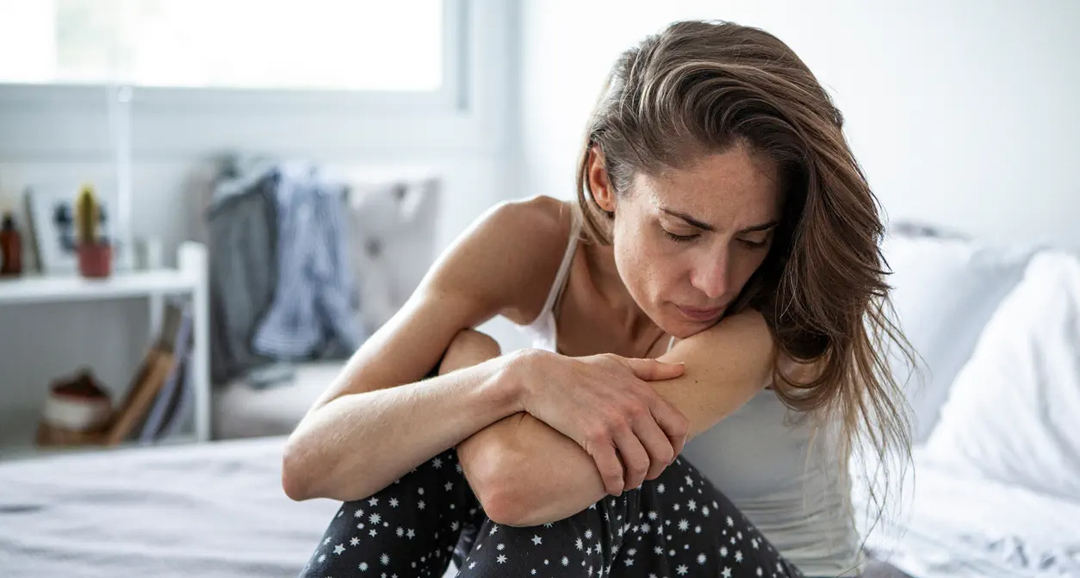 Woman depressed in bed