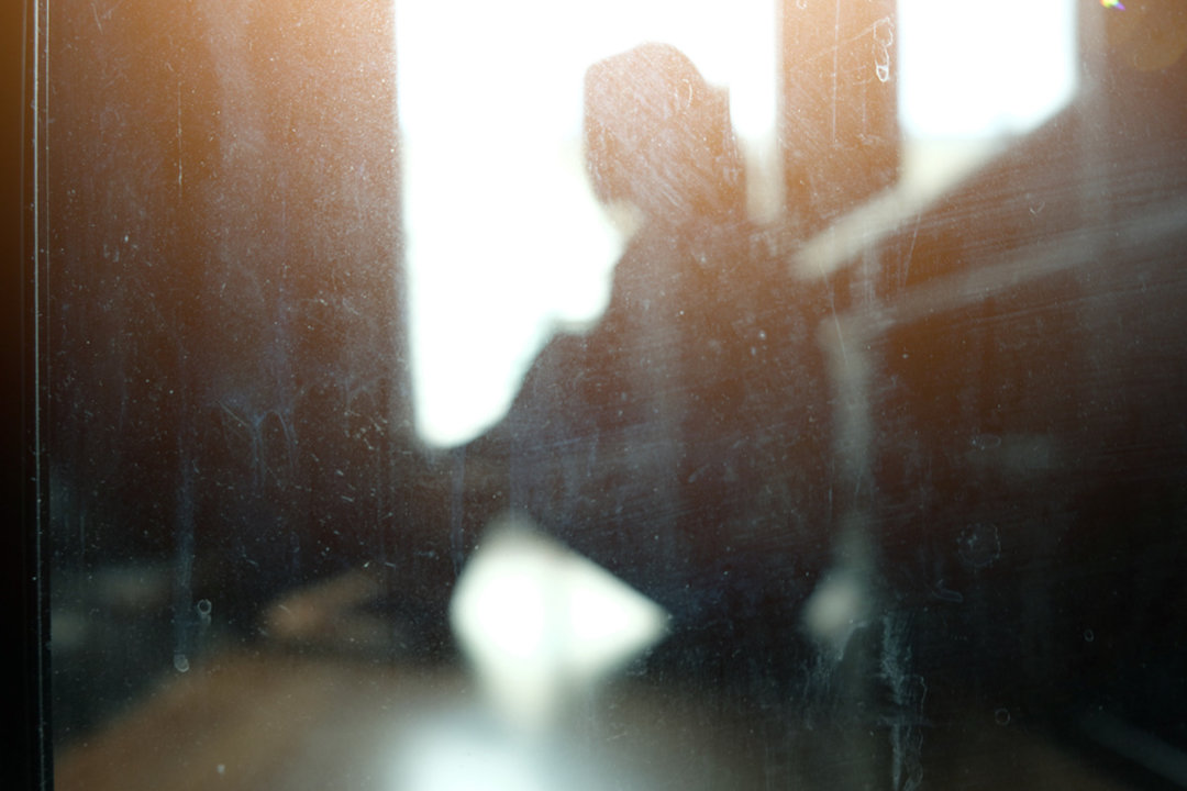 Depressed woman in a dark room