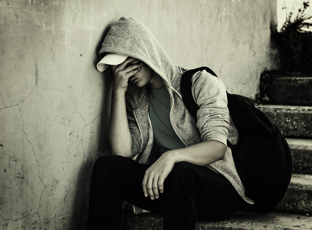 A person sitting depressed