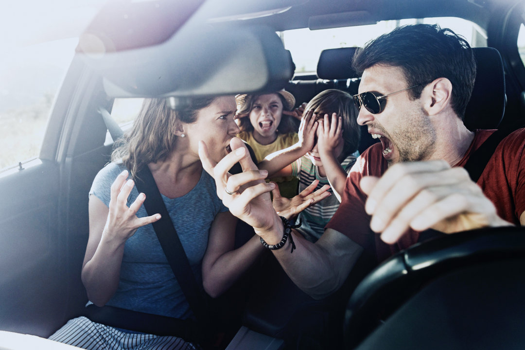 Family having a conflict in a car