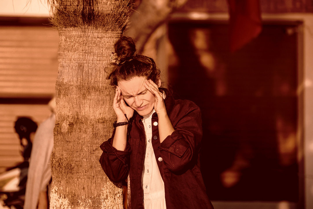 Woman, dizzy and in pain