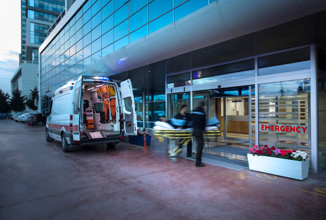 Paramedics at an emergency entrance to a hospital