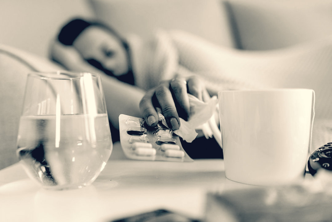 Woman seeming sick reaching for benzos