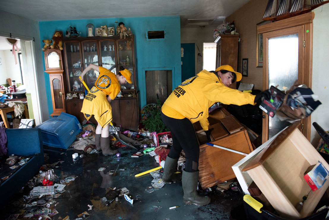 Volunteer Ministers clean out a house