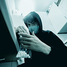 Teenager in a kitchen with valium pills