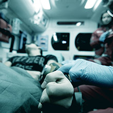 Paramedics checking a pulse