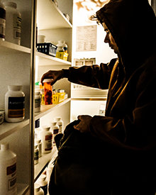 Man stealing opioids from a pharmacy