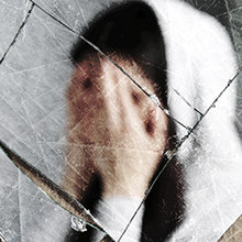 Broken reflection of a person struggling with addiction
