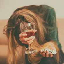 Woman with alcohol and pills