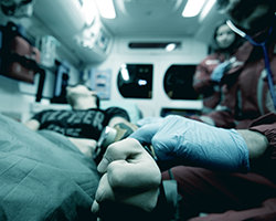 Paramedics checking a pulse