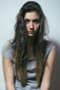 A young woman front on image, showing possible effects of inhalant abuse