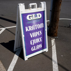 Sandwich board advertising Kratom