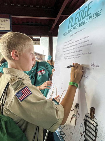 Young man signing the drug-free pledge