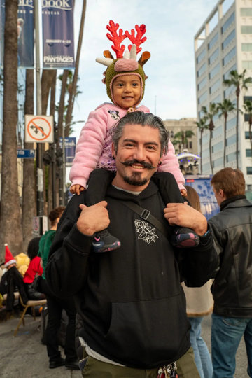 Father and kid at the parade.