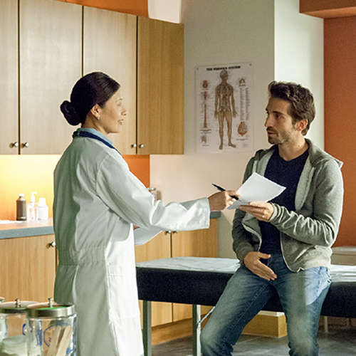 Medical Doctor Giving an Exam to a Student