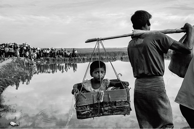 Driven from their homes by civil strife, some 700,000 Rohingya Muslims in Myanmar have crossed into Bangladesh, filling refugee camps there along the Naf River.