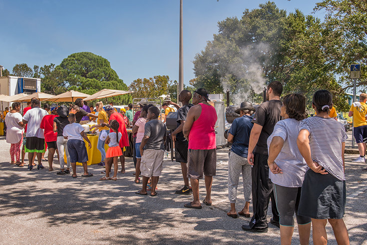 Residents of North Greenwood are served a complimentary barbeque put on by the Church of Scientology Volunteer Ministers