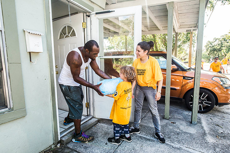 Neighbor to neighbor. Scientology Volunteer Ministers help deliver much-needed ice to North Greenwood residents