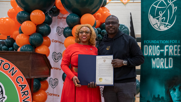 Marshall Faulk being honored with a proclamation announcing Marshall Faulk Day