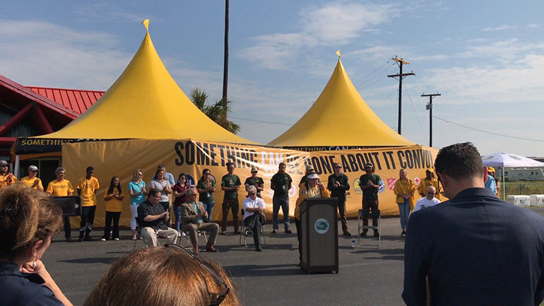 Joava Good, Deputy National Director of Churches of Scientology Disaster Response, at the ceremony at Aransas County Airport welcoming the Something CAN Be Done About It convoy filled with materials to rebuild local homes.