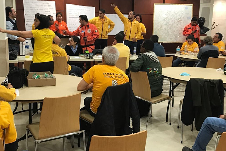 At the Church of Scientology Mexico City Scientology Volunteer Ministers Latin America Coordinator assigns Volunteer Ministers and Los Topos to disaster sites.