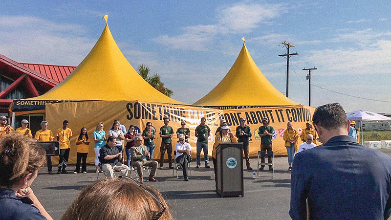 Joava Good, Deputy National Director of Churches of Scientology Disaster Response, at the ceremony at Aransas County Airport welcoming the Something CAN Be Done About It convoy filled with materials to rebuild local homes.