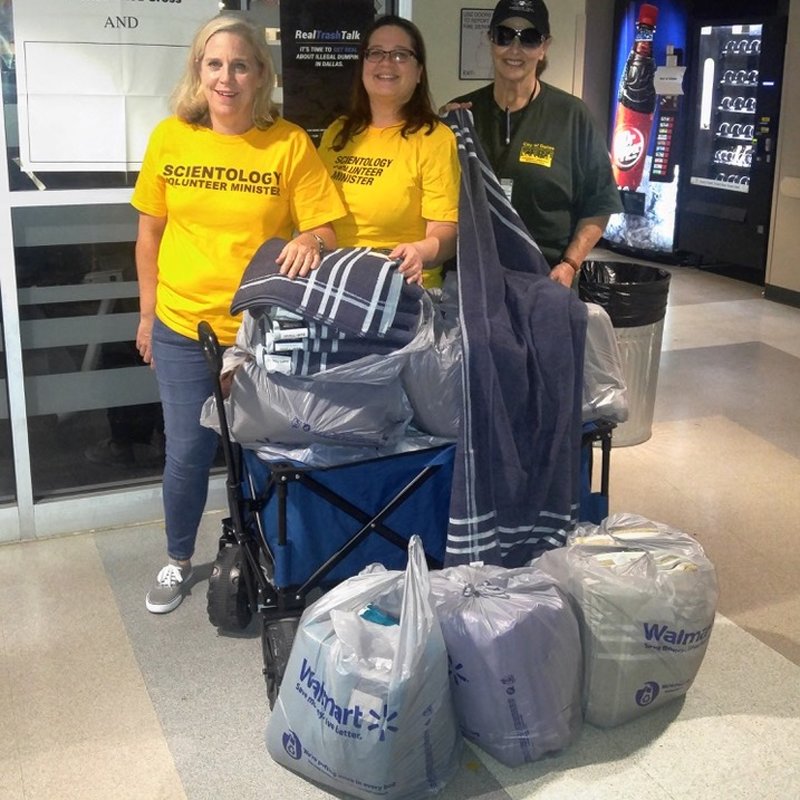 Michelle with 10 bags of towels she donated to a Dallas shelter.