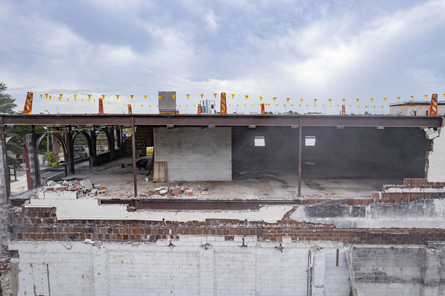 Exposed building structure after wall demolition.