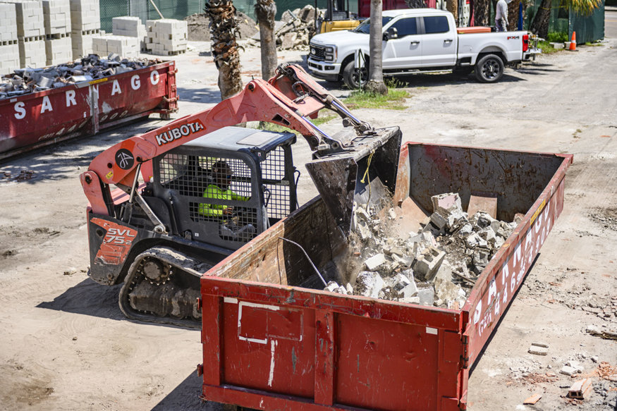 Skid-steer loader removes demolition debris at 639 Cleveland Street.