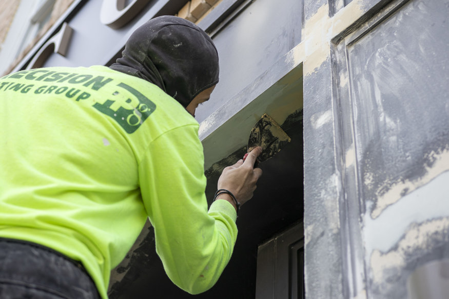 Sealing storefront trim seams.