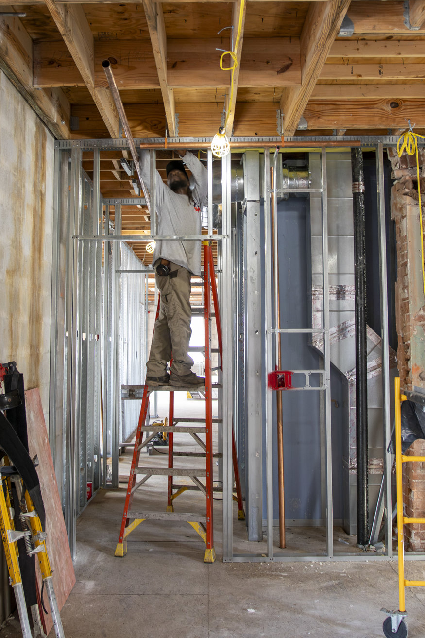 Copper pipes attached to the roof trusses.
