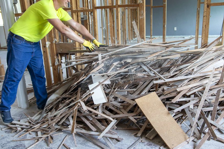 Pile of wood debris being consolidated before removal.