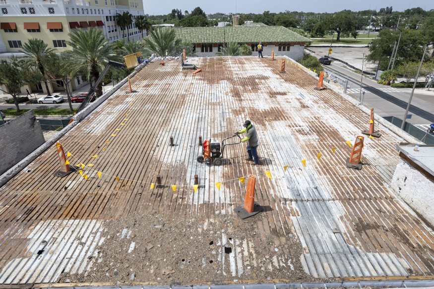 Aerial view of exposed roof decking after material removal.
