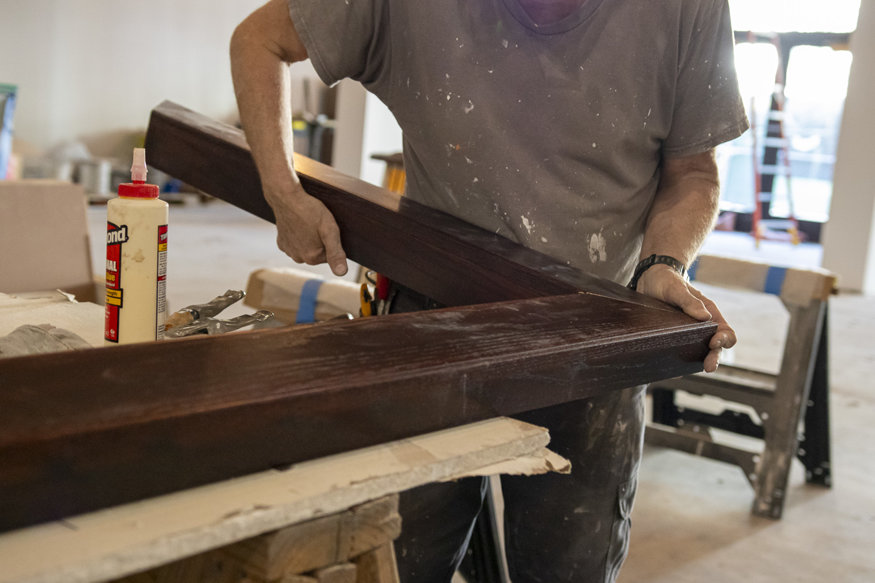 Carpenters assemble the wood frame.