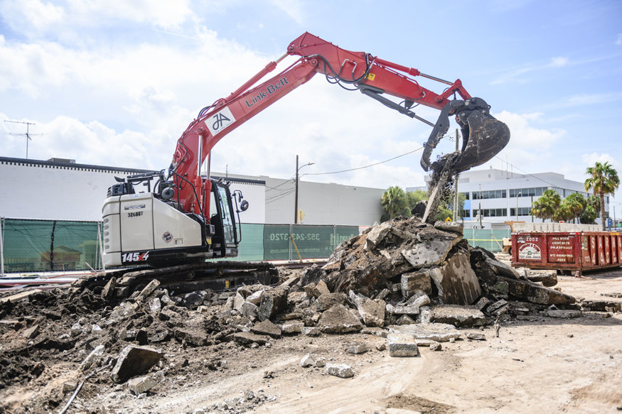 Concrete debris piles collected during slab removal.