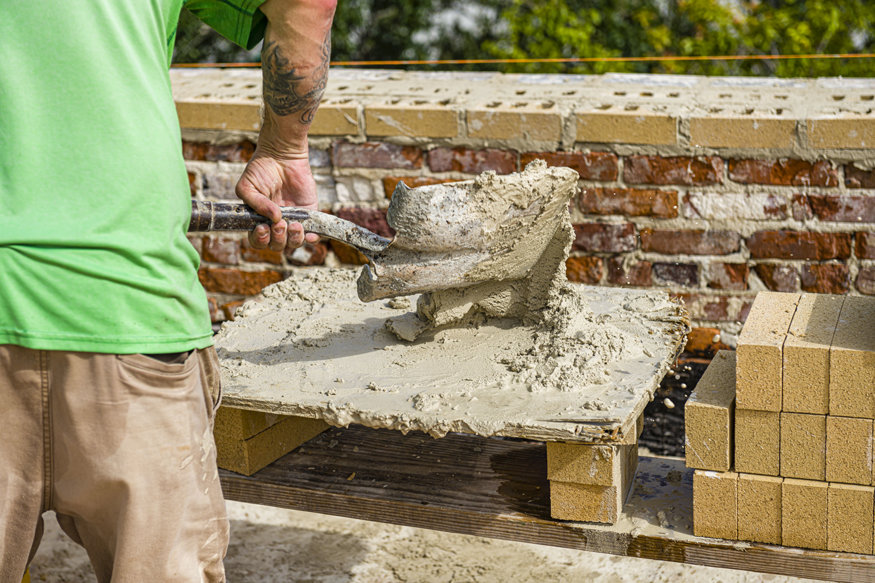 Mortar in front of parapet bricks