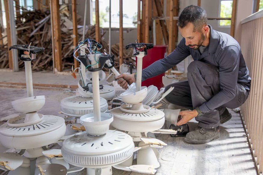 Removed fixtures are staged after disassembly.