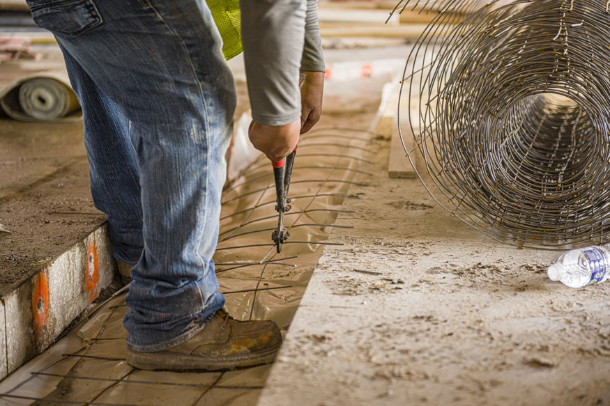 Rebar and mesh ready for concrete pour at trench joint.