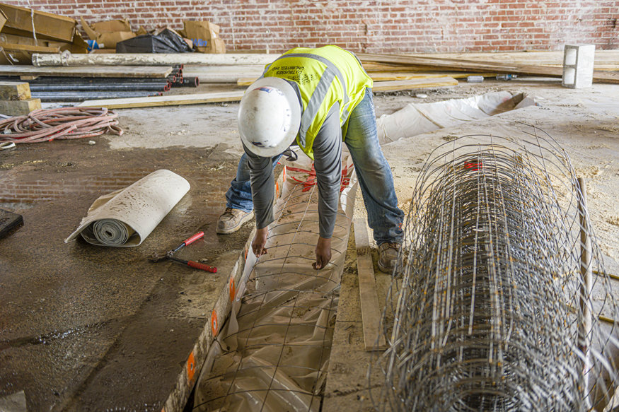 Concrete trench prep underway on first floor of Peoples Bank.