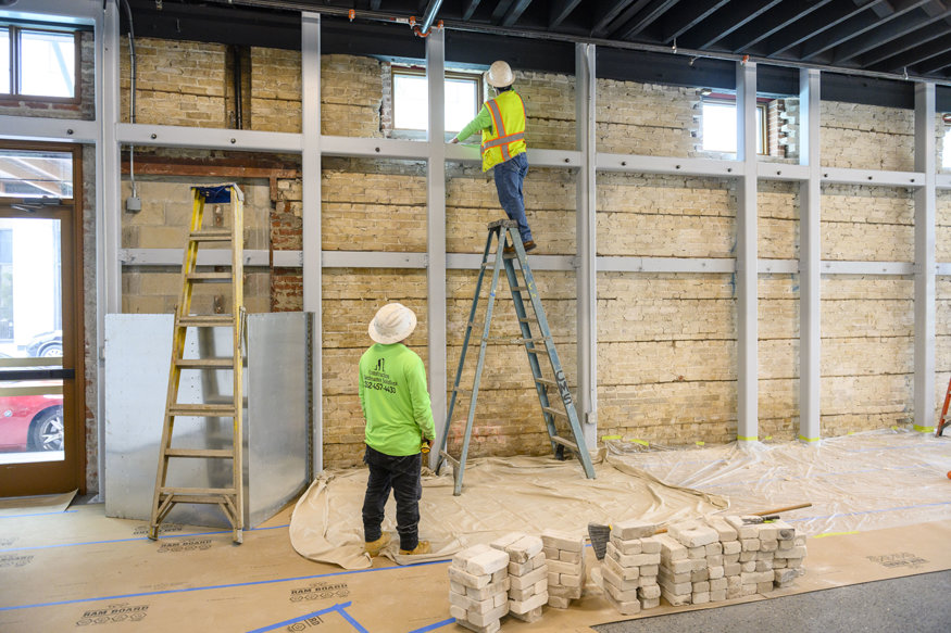 Repaired brickwork around a window used recovered white brick for visual continuity in the Telephone Building.