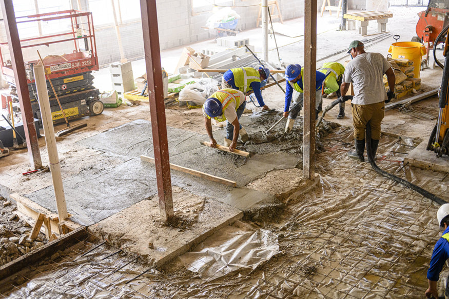 Reinforcing steel surrounds the newly installed grease traps.